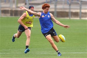 MELBOURNE, AUSTRALIA - JANUARY 06: Ed Richards of the Bulldogs kicks the ball during a Western Bulldogs AFL training session at Whitten Oval on January 06, 2021 in Melbourne, Australia. (Photo by Mike Owen/Getty Images)