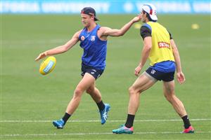 MELBOURNE, AUSTRALIA - JANUARY 06: Will Hayes of the Bulldogs kicks the ball during a Western Bulldogs AFL training session at Whitten Oval on January 06, 2021 in Melbourne, Australia. (Photo by Mike Owen/Getty Images)