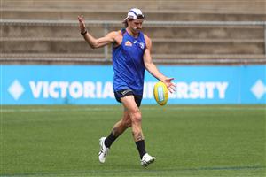 MELBOURNE, AUSTRALIA - JANUARY 06: Josh Bruce kicks the ball during a Western Bulldogs AFL training session at Whitten Oval on January 06, 2021 in Melbourne, Australia. (Photo by Mike Owen/Getty Images)