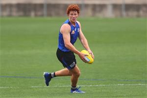 MELBOURNE, AUSTRALIA - JANUARY 06: Ed Richards of the Bulldogs runs with the ball during a Western Bulldogs AFL training session at Whitten Oval on January 06, 2021 in Melbourne, Australia. (Photo by Mike Owen/Getty Images)