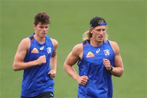 MELBOURNE, AUSTRALIA - JANUARY 06: Aaron Naughton (r) runs during a Western Bulldogs AFL training session at Whitten Oval on January 06, 2021 in Melbourne, Australia. (Photo by Mike Owen/Getty Images)