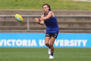 MELBOURNE, AUSTRALIA - JANUARY 06: Corey Preston of the Bulldogs handballs during a Western Bulldogs AFL training session at Whitten Oval on January 06, 2021 in Melbourne, Australia. (Photo by Mike Owen/Getty Images)