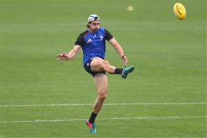 MELBOURNE, AUSTRALIA - JANUARY 06: Easton Wood of the Bulldogs kicks the ball during a Western Bulldogs AFL training session at Whitten Oval on January 06, 2021 in Melbourne, Australia. (Photo by Mike Owen/Getty Images)