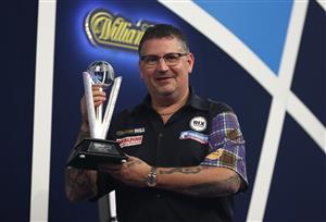 LONDON, ENGLAND - JANUARY 03: Gary Anderson of Scotland poses with the runners-up trophy during the Finals against Gerwyn Price of Wales during Day Sixteen of The PDC William Hill World Darts Championship at Alexandra Palace on January 03, 2021 in London, England. (Photo by Luke Walker/Getty Images)