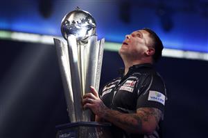 LONDON, ENGLAND - JANUARY 03: Gerwyn Price of Wales poses with the trophy during the Finals against Gary Anderson of Scotlandduring Day Sixteen of The PDC William Hill World Darts Championship at Alexandra Palace on January 03, 2021 in London, England. (Photo by Luke Walker/Getty Images)