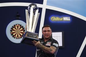 LONDON, ENGLAND - JANUARY 03: Gerwyn Price of Wales poses with the trophy during the Finals against Gary Anderson of Scotlandduring Day Sixteen of The PDC William Hill World Darts Championship at Alexandra Palace on January 03, 2021 in London, England. (Photo by Luke Walker/Getty Images)
