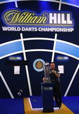 LONDON, ENGLAND - JANUARY 03: Gerwyn Price of Wales poses with the trophy during the Finals against Gary Anderson of Scotlandduring Day Sixteen of The PDC William Hill World Darts Championship at Alexandra Palace on January 03, 2021 in London, England. (Photo by Luke Walker/Getty Images)