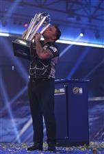 LONDON, ENGLAND - JANUARY 03: Gerwyn Price of Wales poses with the trophy during the Finals against Gary Anderson of Scotlandduring Day Sixteen of The PDC William Hill World Darts Championship at Alexandra Palace on January 03, 2021 in London, England. (Photo by Luke Walker/Getty Images)