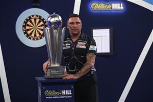 LONDON, ENGLAND - JANUARY 03: Gerwyn Price of Wales poses with the trophy during the Finals against Gary Anderson of Scotlandduring Day Sixteen of The PDC William Hill World Darts Championship at Alexandra Palace on January 03, 2021 in London, England. (Photo by Luke Walker/Getty Images)