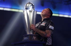 LONDON, ENGLAND - JANUARY 03: Gerwyn Price of Wales poses with the trophy during the Finals against Gary Anderson of Scotlandduring Day Sixteen of The PDC William Hill World Darts Championship at Alexandra Palace on January 03, 2021 in London, England. (Photo by Luke Walker/Getty Images)