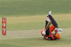 PERTH, AUSTRALIA - JANUARY 06: Ashton Turner of the Scorchers takes a tumble after playing a ramp shot to the boundary during the Big Bash League match between the Perth Scorchers and the Sydney Sixers at Optus Stadium, on January 06, 2021, in Perth, Australia. (Photo by Paul Kane/Getty Images)