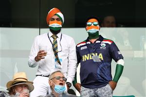 SYDNEY, AUSTRALIA - JANUARY 07: India fans wear face masks during day one of the 3rd Test match in the series between Australia and India at Sydney Cricket Ground on January 07, 2021 in Sydney, Australia. (Photo by Ryan Pierse/Getty Images)