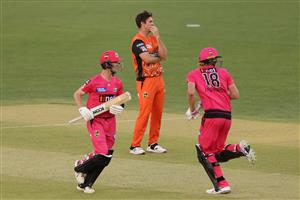 PERTH, AUSTRALIA - JANUARY 06: Mitch Marsh of the Scorchers looks on as Jordan Silk and Jack Edwards of the Sixers take a run during the Big Bash League match between the Perth Scorchers and the Sydney Sixers at Optus Stadium, on January 06, 2021, in Perth, Australia. (Photo by Paul Kane/Getty Images)