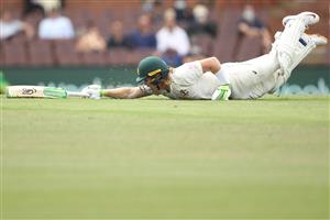 SYDNEY, AUSTRALIA - JANUARY 07: Will Pucovski of Australia dives to make his ground during day one of the Third Test match in the series between Australia and India at Sydney Cricket Ground on January 07, 2021 in Sydney, Australia. (Photo by Mark Kolbe/Getty Images)