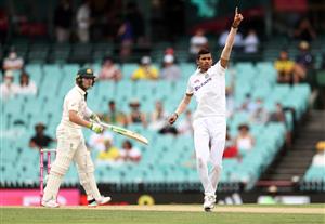 SYDNEY, AUSTRALIA - JANUARY 07: Navdeep Saini of India celebrates after taking the wicket of Will Pucovski of Australia during day one of the 3rd Test match in the series between Australia and India at Sydney Cricket Ground on January 07, 2021 in Sydney, Australia. (Photo by Ryan Pierse/Getty Images)