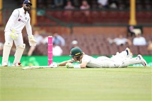 SYDNEY, AUSTRALIA - JANUARY 07: Rishabh Pant of India looks at Will Pucovski of Australia after he dived to make his ground during day one of the Third Test match in the series between Australia and India at Sydney Cricket Ground on January 07, 2021 in Sydney, Australia. (Photo by Mark Kolbe/Getty Images)