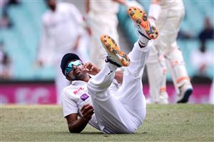 Indias Ravichandran Ashwin dives to stop the ball during day two of the third cricket Test match between Australia and India at the Sydney Cricket Ground (SCG) on January 8, 2021. (Photo by DAVID GRAY / AFP) / --IMAGE RESTRICTED TO EDITORIAL USE - NO COMMERCIAL USE-- (Photo by DAVID GRAY/AFP via Getty Images)