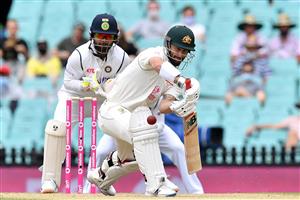 Australian batsman Matthew Wade plays a shot as Indian wicketkeeper Rishabh Pant (L) looks on during the day two of the third cricket Test match at Sydney Cricket Ground (SCG) between Australia and India on January 8, 2021. (Photo by Saeed KHAN / AFP) / --IMAGE RESTRICTED TO EDITORIAL USE - NO COMMERCIAL USE-- (Photo by SAEED KHAN/AFP via Getty Images)