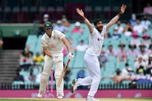 Indian paceman Jasprit Bumrah (R) celebrates his wicket off Australian batsman Cameron Green (L) on day two of the third cricket Test match at Sydney Cricket Ground (SCG) between Australia and India on January 8, 2021. (Photo by Saeed KHAN / AFP) / --IMAGE RESTRICTED TO EDITORIAL USE - NO COMMERCIAL USE-- (Photo by SAEED KHAN/AFP via Getty Images)