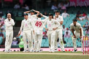 SYDNEY, AUSTRALIA - JANUARY 08: Nathan Lyon of Australia and team mates watch a review during day two of the Third Test match in the series between Australia and India at Sydney Cricket Ground on January 08, 2021 in Sydney, Australia. (Photo by Cameron Spencer/Getty Images)