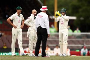 SYDNEY, AUSTRALIA - JANUARY 08: Nathan Lyon and Tim Paine of Australia reacts speak to Umpire Paul Wilson as a DRS referral against Ajinkya Rahane of India was requested during day two of the 3rd Test match in the series between Australia and India at Sydney Cricket Ground on January 08, 2021 in Sydney, Australia. (Photo by Ryan Pierse/Getty Images)