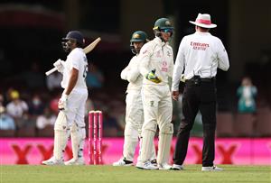 SYDNEY, AUSTRALIA - JANUARY 08: Tim Paine of Australia speaks with Umpire Paul Reiffel after the out decision against Rohit Sharma of India was overturned during day two of the 3rd Test match in the series between Australia and India at Sydney Cricket Ground on January 08, 2021 in Sydney, Australia. (Photo by Ryan Pierse/Getty Images)