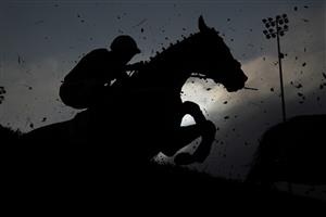SUNBURY, ENGLAND - JANUARY 09: A general view as runners clear a fence during The Ladbrokes Committed To Safer Gambling Handicap Chase at Kempton Park Racecourse on January 09, 2021 in Sunbury, England. Due to the Coronavirus pandemic, owners along with the paying public will not be allowed to attend the meeting. (Photo by Alan Crowhurst/Getty Images)