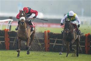SUNBURY, ENGLAND - JANUARY 09: Harry Cobden riding Barbados Buck's clear the last to win The Play Ladbrokes 1-2-Free On Football Novices' Hurdle at Kempton Park Racecourse on January 09, 2021 in Sunbury, England. Due to the Coronavirus pandemic, owners along with the paying public will not be allowed to attend the meeting. (Photo by Alan Crowhurst/Getty Images)