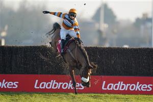 SUNBURY, ENGLAND - JANUARY 09: Harry Cobden riding Master Tommytucker smash through the last fence but remain upright to win The Ladbrokes Silviniaco Conti Chase at Kempton Park Racecourse on January 09, 2021 in Sunbury, England. Due to the Coronavirus pandemic, owners along with the paying public will not be allowed to attend the meeting. (Photo by Alan Crowhurst/Getty Images)