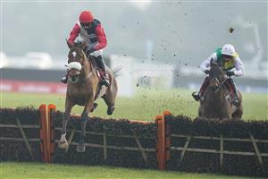 SUNBURY, ENGLAND - JANUARY 09: Harry Cobden riding Barbados Buck's clear the last to win The Play Ladbrokes 1-2-Free On Football Novices' Hurdle at Kempton Park Racecourse on January 09, 2021 in Sunbury, England. Due to the Coronavirus pandemic, owners along with the paying public will not be allowed to attend the meeting. (Photo by Alan Crowhurst/Getty Images)
