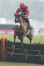SUNBURY, ENGLAND - JANUARY 09: Harry Cobden riding Barbados Buck's clear the last to win The Play Ladbrokes 1-2-Free On Football Novices' Hurdle at Kempton Park Racecourse on January 09, 2021 in Sunbury, England. Due to the Coronavirus pandemic, owners along with the paying public will not be allowed to attend the meeting. (Photo by Alan Crowhurst/Getty Images)