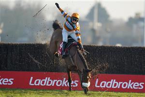 SUNBURY, ENGLAND - JANUARY 09: Harry Cobden riding Master Tommytucker smash through the last fence but remain upright to win The Ladbrokes Silviniaco Conti Chase at Kempton Park Racecourse on January 09, 2021 in Sunbury, England. Due to the Coronavirus pandemic, owners along with the paying public will not be allowed to attend the meeting. (Photo by Alan Crowhurst/Getty Images)