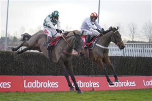 SUNBURY, ENGLAND - JANUARY 09: Richard Johnson riding Smarty Wild (L) clear the last to win The Ladbrokes Where The Nation Plays Handicap Chase from Nico de Boinville and Pistol Whipped at Kempton Park Racecourse on January 09, 2021 in Sunbury, England. Due to the Coronavirus pandemic, owners along with the paying public will not be allowed to attend the meeting. (Photo by Alan Crowhurst/Getty Images)