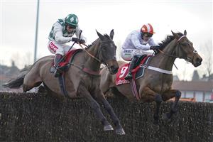 SUNBURY, ENGLAND - JANUARY 09: Richard Johnson riding Smarty Wild (L) clear the last to win The Ladbrokes Where The Nation Plays Handicap Chase from Nico de Boinville and Pistol Whipped at Kempton Park Racecourse on January 09, 2021 in Sunbury, England. Due to the Coronavirus pandemic, owners along with the paying public will not be allowed to attend the meeting. (Photo by Alan Crowhurst/Getty Images)