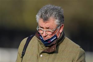 SUNBURY, ENGLAND - JANUARY 09: Trainer Paul Nicholls poses at Kempton Park Racecourse on January 09, 2021 in Sunbury, England. Due to the Coronavirus pandemic, owners along with the paying public will not be allowed to attend the meeting. (Photo by Alan Crowhurst/Getty Images)