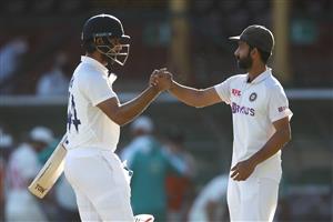 SYDNEY, AUSTRALIA - JANUARY 11: Hanuma Vihari of India shakes hands with his captain Ajinkya Rahane of India as they celebrate securing a draw during day five of the Third Test match in the series between Australia and India at Sydney Cricket Ground on January 11, 2021 in Sydney, Australia. (Photo by Mark Kolbe/Getty Images)