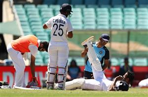 SYDNEY, AUSTRALIA - JANUARY 11: Hanuma Vihari of India receives treatment for a leg injury during day five of the 3rd Test match in the series between Australia and India at Sydney Cricket Ground on January 11, 2021 in Sydney, Australia. (Photo by Ryan Pierse/Getty Images)