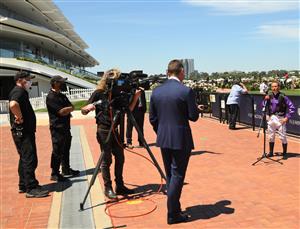 MELBOURNE, AUSTRALIA - JANUARY 09: Damien Oliver is seen social distancing during interview after riding Milton Park to win Race 2, the The Mumm Royale, during Melbourne Racing at Flemington Racecourse on January 09, 2021 in Melbourne, Australia. (Photo by Vince Caligiuri/Getty Images)