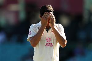 SYDNEY, AUSTRALIA - JANUARY 11: Mitchell Starc of Australia adjusts his sweat band during day five of the Third Test match in the series between Australia and India at Sydney Cricket Ground on January 11, 2021 in Sydney, Australia. (Photo by Mark Kolbe/Getty Images)