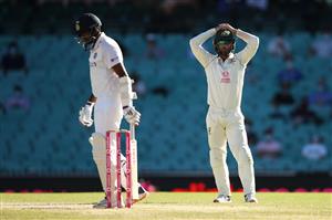 SYDNEY, AUSTRALIA - JANUARY 11: Ravichandran Ashwin of India walks away as Matthew Wade of Australia shows his frustration during day five of the Third Test match in the series between Australia and India at Sydney Cricket Ground on January 11, 2021 in Sydney, Australia. (Photo by Mark Kolbe/Getty Images)