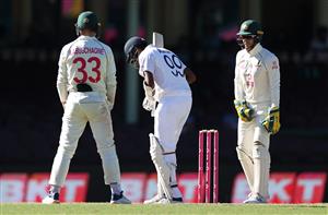 SYDNEY, AUSTRALIA - JANUARY 11: Tim Paine of Australia speaks to Ravichandran Ashwin of India during day five of the 3rd Test match in the series between Australia and India at Sydney Cricket Ground on January 11, 2021 in Sydney, Australia. (Photo by Ryan Pierse/Getty Images)