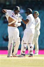 SYDNEY, AUSTRALIA - JANUARY 11: Ravichandran Ashwin of India is helped with his chest guard by Hanuma Vihari of India bats during day five of the Third Test match in the series between Australia and India at Sydney Cricket Ground on January 11, 2021 in Sydney, Australia. (Photo by Mark Kolbe/Getty Images)