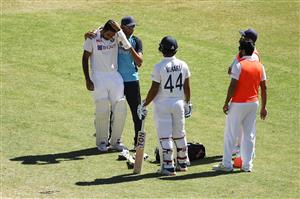 SYDNEY, AUSTRALIA - JANUARY 11: Ravichandran Ashwin of India receives attention after being struck by a short ball during day five of the Third Test match in the series between Australia and India at Sydney Cricket Ground on January 11, 2021 in Sydney, Australia. (Photo by Mark Kolbe/Getty Images)