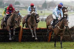 PLUMPTON, ENGLAND - JANUARY 13: Lewis Stones riding Here Comes Johny (C, red cap) on their way to winning The Tie The Knot Wedding Catering Novices' Hurdle at Plumpton Racecourse on January 13, 2021 in Plumpton, England. Due to the Coronavirus pandemic, owners along with the paying public will not be allowed to attend the meeting. (Photo by Alan Crowhurst/Getty Images)