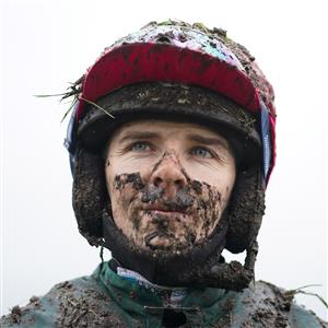 FONTWELL, ENGLAND - JANUARY 14: A wet and Muddy Micheal Nolan after riding in the first at Fontwell Park Racecourse on January 14, 2021 in Fontwell, England. Due to the Coronavirus pandemic, owners along with the paying public will not be allowed to attend the meeting. (Photo by Alan Crowhurst/Getty Images)
