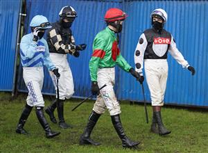FONTWELL, ENGLAND - JANUARY 14: A general view as jockeys make their way to the parade ring at Fontwell Park Racecourse on January 14, 2021 in Fontwell, England. Due to the Coronavirus pandemic, owners along with the paying public will not be allowed to attend the meeting. (Photo by Alan Crowhurst/Getty Images)