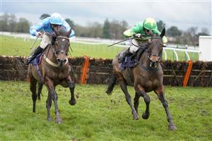 FONTWELL, ENGLAND - JANUARY 14: Ben Godfrey riding Lily The Pink (R) clear the last to win The Visit attheraces.com Handicap Hurdle at Fontwell Park Racecourse on January 14, 2021 in Fontwell, England. Due to the Coronavirus pandemic, owners along with the paying public will not be allowed to attend the meeting. (Photo by Alan Crowhurst/Getty Images)