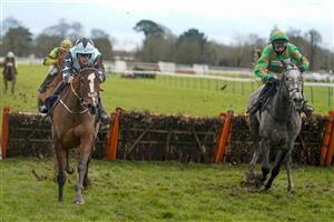 FONTWELL, ENGLAND - JANUARY 14: Aidan Coleman riding Allavina (L, blue) clear the last to win The Sky Sports Racing Sky 415 Mares' Novices' Hurdle at Fontwell Park Racecourse on January 14, 2021 in Fontwell, England. Due to the Coronavirus pandemic, owners along with the paying public will not be allowed to attend the meeting. (Photo by Alan Crowhurst/Getty Images)