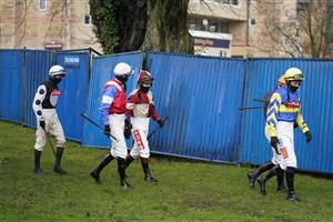 FONTWELL, ENGLAND - JANUARY 14: A general view as jockeys make their way to the parade ring at Fontwell Park Racecourse on January 14, 2021 in Fontwell, England. Due to the Coronavirus pandemic, owners along with the paying public will not be allowed to attend the meeting. (Photo by Alan Crowhurst/Getty Images)