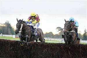 FONTWELL, ENGLAND - JANUARY 14: Tom Scudamore riding Umbrigado (L) clear the last to win The Subscribe To attheraces On YouTube Novices' Chase at Fontwell Park Racecourse on January 14, 2021 in Fontwell, England. Due to the Coronavirus pandemic, owners along with the paying public will not be allowed to attend the meeting. (Photo by Alan Crowhurst/Getty Images)
